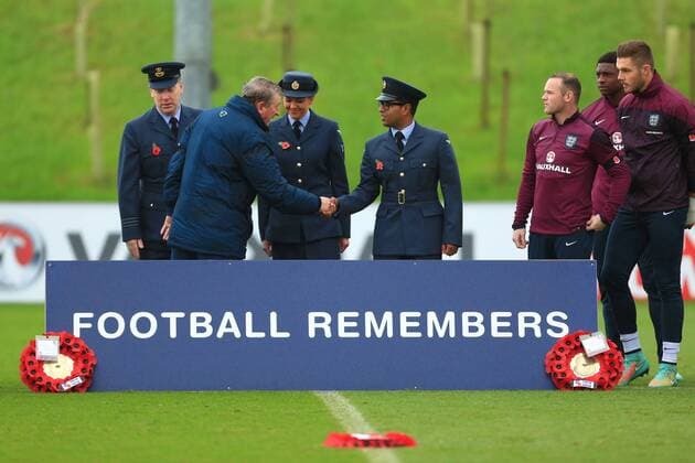 Roy Hodgson, England manager and Wayne Rooney join service personnel for two minutes silence - England Training & Press Conference - UEFA Euro 2016 Qualifying - St George s Park - Burton-upon-Trent - 11 11 2014 Pic Philip Oldham Sportimage EDITORIAL USE ONLY. No use with unauthorised audio, video, data, fixture lists, club league logos or live services. Online in-match use limited to 120 images, no video emulation. No use in betting, games or single club league player publications.