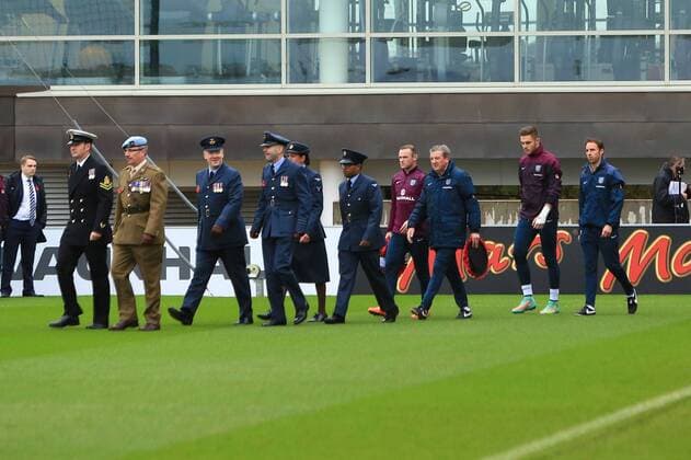 Service personnel lead out the England squad - England Training & Press Conference - UEFA Euro 2016 Qualifying - St George s Park - Burton-upon-Trent - 11 11 2014 Pic Philip Oldham Sportimage EDITORIAL USE ONLY. No use with unauthorised audio, video, data, fixture lists, club league logos or live services. Online in-match use limited to 120 images, no video emulation. No use in betting, games or single club league player publications.