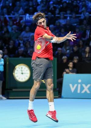 Tennis - 2014 ATP Tennis Herren World Tour Finals at The O2 - Day Three, Group B Singles: Roger Federer returns a serve from Kei Nishikori  ATP_DAY3
