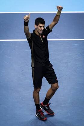 LONDON, Nov. 12, 2014 -- Novak Djokovic of Serbia celebrates after the ATP Tennis Herren World Tour Finals Group match in London, Britain, on Nov. 12, 2014. TangxShi 