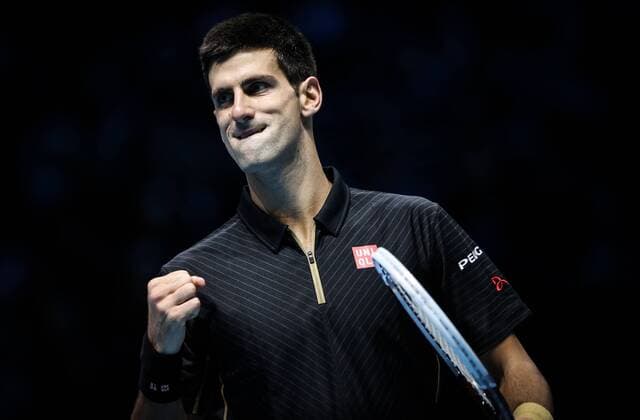 LONDON, Nov. 12, 2014 -- Novak Djokovic of Serbia celebrates scoring during the ATP Tennis Herren World Tour Finals Group match in London, Britain, on Nov. 12, 2014. TangxShi 