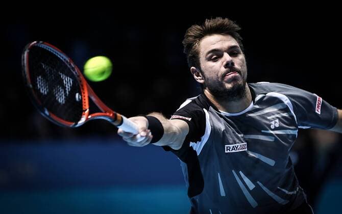 LONDON, Nov. 12, 2014 -- Stanislas Wawrinka of Switzerland returns the ball during the ATP Tennis Herren World Tour Finals Group match in London, Britain, on Nov. 12, 2014. TangxShi 
