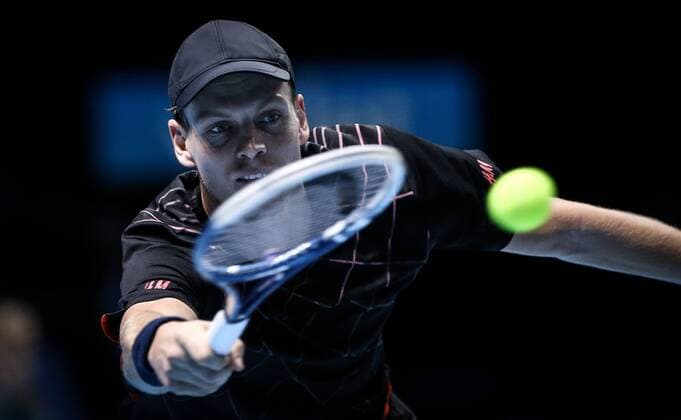 LONDON, Nov. 12, 2014 -- Tomas Berdych of the Czech Republic returns the ball during the ATP Tennis Herren World Tour Finals Group match in London, Britain, on Nov. 12, 2014. TangxShi 