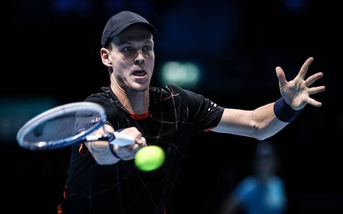 LONDON, Nov. 12, 2014 -- Tomas Berdych of the Czech Republic returns the ball during the ATP Tennis Herren World Tour Finals Group match in London, Britain, on Nov. 12, 2014. TangxShi 