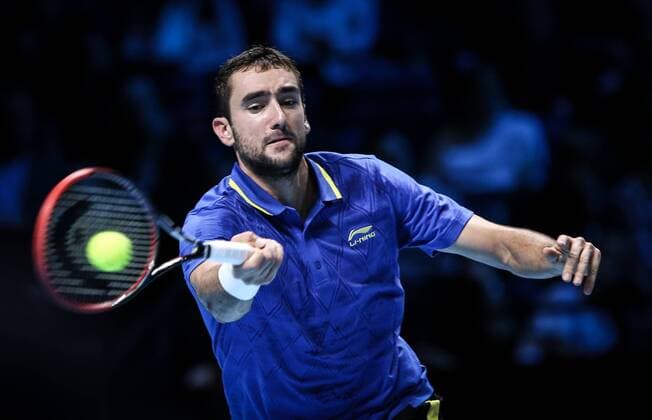 LONDON, Nov. 12, 2014 -- Marin Cilic of Croatia returns the ball during the ATP Tennis Herren World Tour Finals Group match in London, Britain, on Nov. 12, 2014. TangxShi 