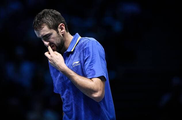LONDON, Nov. 12, 2014 -- Marin Cilic of Croatia reacts during the ATP Tennis Herren World Tour Finals Group match in London, Britain, on Nov. 12, 2014. TangxShi 