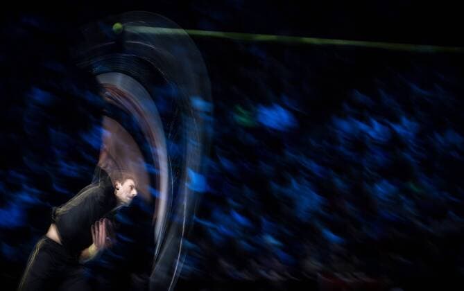 LONDON, Nov. 12, 2014 -- Novak Djokovic of Serbia serves during the ATP Tennis Herren World Tour Finals Group match in London, Britain, on Nov. 12, 2014. TangxShi 
