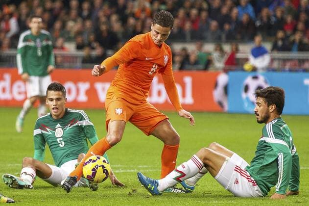 (L-R) Diego Reyes of Mexico, Ibrahim Afellay of Holland, Oswaldo Alanis Pantoja of Mexico during the International friendly match between Netherlands and Mexico on November 12, 2014 at the Amsterdam Arena in Amsterdam, The Netherlands. Netherlands v Mexico International Friendly 2014 2015 xVIxxIVx 3268704