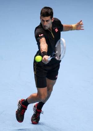 Tennis - 2014 ATP Tennis Herren World Tour Finals at The O2 - Day Three, Group A Novak Djokovic with a backhand 