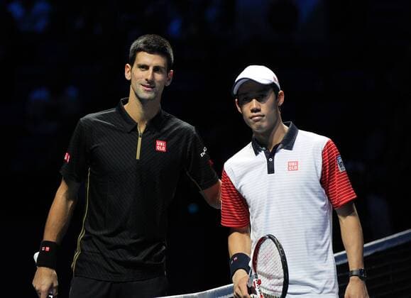 TENNIS - ATP, World Tour Finals 2014 LONDON,ENGLAND,15.NOV.14 - TENNIS - ATP Tennis Herren World Tour, World Tour Finals 2014. Image shows Novak Djokovic (SRB) and Kei Nishikori (JPN). 