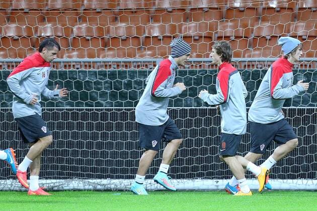CRO football training - Milan, Italy 15.11.2014., Milan, Italy - Short training of Croatian football team during heavy rain on the San Siro stadium. After press conference it was decided that training will be held.  GoranxStanzl PIXSELL