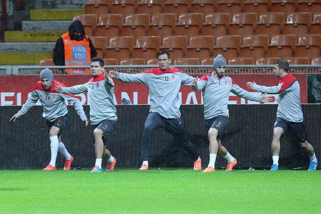 CRO football training - Milan, Italy 15.11.2014., Milan, Italy - Hrvoje Milic Dejan Lovren Lovre Kalinic Sime Vrsaljko Domagoj Antolic at Short training of Croatian football team during heavy rain on the San Siro stadium. After press conference it was decided that training will be held.  GoranxStanzl PIXSELL
