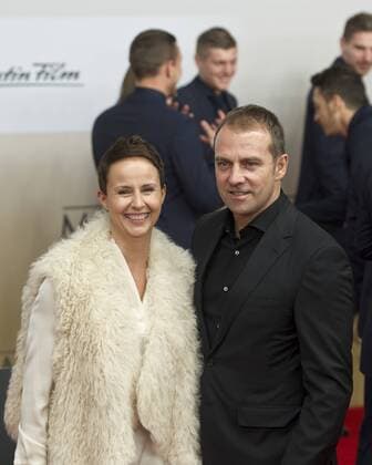 Auf dem Roten Teppich: Hans-Dieter FLICK mit seiner Frau Silke Vorstellung und Weltpremiere des Dokumentarfilmes Die Mannschaft im CineStar Sony Center in Berlin, Deutschland am 10.11.2014, die Deutsche Fussballnationalmannschaft zeigt sich in einem Film zur Fussballweltmeisterschaft 2014 in Brasilien.