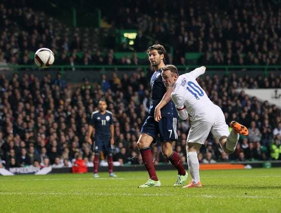 England s Wayne Rooney scoring his sides second goal - International Friendly - Scotland vs England- Celtic Park - Glasgow - Scotland - 18th November 2014 - Picture David Klein Sportimage EDITORIAL USE ONLY. No use with unauthorised audio, video, data, fixture lists, club league logos or live services. Online in-match use limited to 120 images, no video emulation. No use in betting, games or single club league player publications.