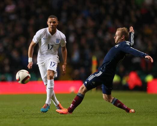 Scotland s Barry Bannan tussles with England s Kieran Gibbs - International Friendly - Scotland vs England- Celtic Park - Glasgow - Scotland - 18th November 2014 - Picture David Klein Sportimage EDITORIAL USE ONLY. No use with unauthorised audio, video, data, fixture lists, club league logos or live services. Online in-match use limited to 120 images, no video emulation. No use in betting, games or single club league player publications.