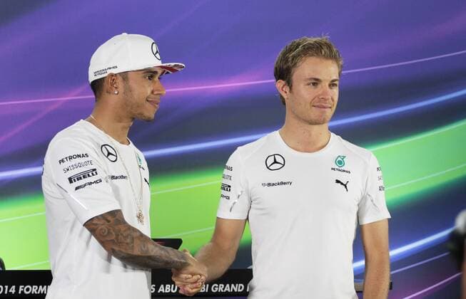 - ABU DHABI, UNITED ARAB EMIRATES: British Lewis Hamilton of Mercedes AMG Petronas F1 Team and German Nico Rosberg of Mercedes AMG Petronas F1 Team shakes hands at a press conference, part of preparations ahead of the 2014 Abu Dhabi Grand Prix Formula One race, at the Yas Marina Circuit in Abu Dhabi, United Arab Emirates . GEORGESxDExCOSTER  xpremiumd 38690x