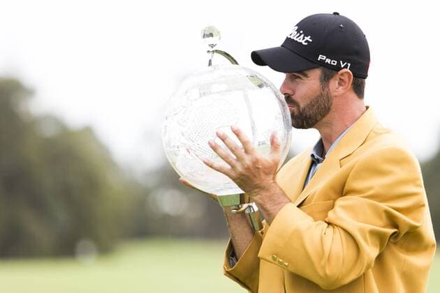 November 23, 2014: Nick Cullen during the trophy presentation wearing the golden jacket kisses the trophy during the final round of the Australian Golf Masters at Metropolitan Golf Club, Melbourne Victoria Australia GOLF: NOV 23 Australian Masters - Final Round Icon14112367 EDITORIAL USE ONLY