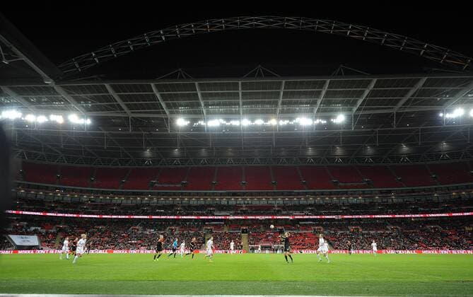 The famous Wembley Stadium with the floodlit arch during the 2nd half of the match - Womens International Football - England - Wembley Stadium - London, England - 23rdNovember 2014 - EDITORIAL USE ONLY. No use with unauthorised audio, video, data, fixture lists, club league logos or live services. Online in-match use limited to 120 images, no video emulation. No use in betting, games or single club league player publications.