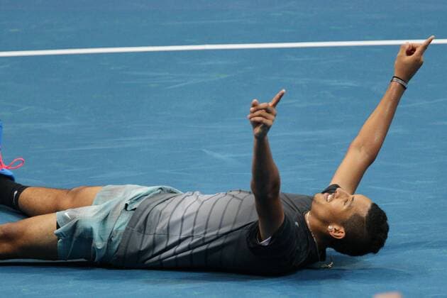 Nov. 29, 2014 - Manila, Philippines - Nick Kyrgios of the Singapore Slammers celebrates after defeating Marin Cilic and Nenad Zimonjic of the UAE Royals during their doubles match at the International Premier Tennis League (IPTL) in Philippines, Saturday, November 29, 2014. International Premier Tennis League  - ZUMAn230