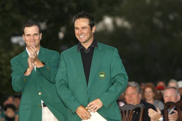 April 14, 2008 - Zach Johnson, left, the 2007 Masters champion, claps after putting the green jacket on Trevor Immelman during the green jacket presentation after the final round of the Masters tournament at Augusta National Golf Club, Sunday, April 13, 2008, in Augusta, Georgia. (C. Aluka Berry The State MCT) News Archive - April 14, 2008 - ZUMAm67_