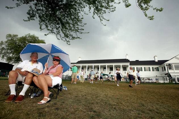 Aug. 9, 2008 - Don Bowman, of Ann Arbor, and his wife, Lynne, wait out a brief storm as head for cover during the third round of play at the PGA Golf Herren Championship tournament at Oakland Hills Country Club in Bloomfield Hills, Michigan, Saturday, August 9, 2008. (Andre J. Jackson Detroit Free Press MCT) News Archive - Aug. 9, 2008 - ZUMAm67_
