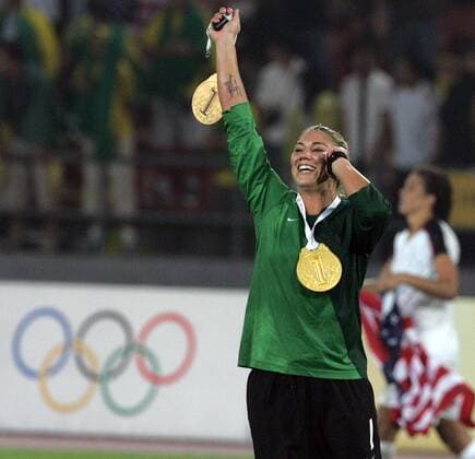 Aug. 22, 2008 - Hope Solo of the United States talks on the phone and waves while wearing imitation gold medals after an overtime victory over Brazil for the gold medal on Thursday, August 21, 2008, in the Games of the the XXIX Olympiad in Beijing, China. (Eric Seals Detroit Free Press MCT) News Archive - Aug. 22, 2008 - ZUMAm67_