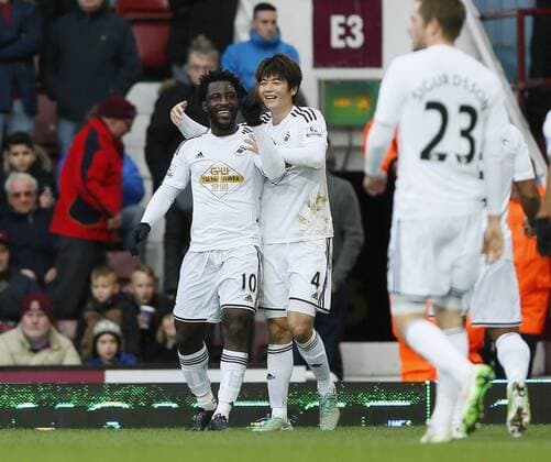 Swansea s Wilfred Bony celebrates scoring his sides opening goal Barclays Premier League- West Ham United vs Swansea City - Upton Park - England - 7th December 2014 - Picture David Klein Sportimage EDITORIAL USE ONLY. No use with unauthorised audio, video, data, fixture lists, club league logos or live services. Online in-match use limited to 120 images, no video emulation. No use in betting, games or single club league player publications.
