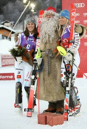 ALPINE SKIING - FIS WC Aare AARE,SWEDEN,13.DEC.14 - ALPINE SKIING - FIS World Cup, slalom, ladies, award ceremony. Image shows the rejoicing of Maria Pietilae-Holmner (SWE), Santa Claus and Frida Hansdotter (SWE).
