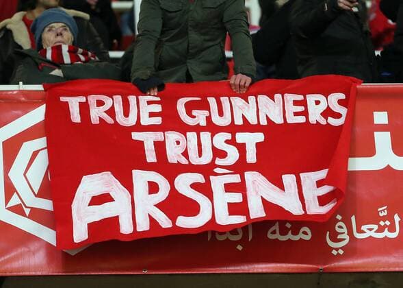 Arsenal fans show a banner to support Arsene Wenger Barclays Premier League- Arsenal FC - Emirates Stadium - England - 13th December 2014 - EDITORIAL USE ONLY. No use with unauthorised audio, video, data, fixture lists, club league logos or live services. Online in-match use limited to 120 images, no video emulation. No use in betting, games or single club league player publications.