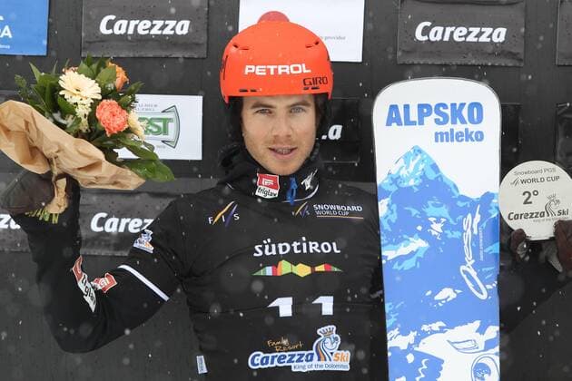 SNOWBOARD - FIS WC Carezza, qualification CAREZZA,ITALY,16.DEC.14 - SNOWBOARD - FIS World Cup, parallel giant slalom, men, award ceremony. Image shows Zan Kosir (SLO). Keywords: trophy.