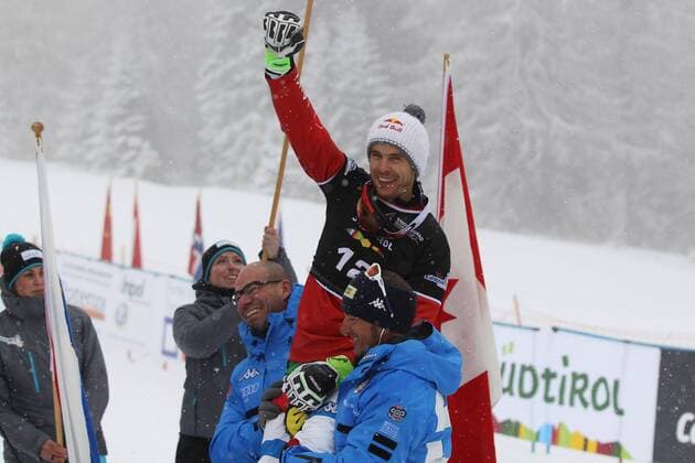 SNOWBOARD - FIS WC Carezza, qualification CAREZZA,ITALY,16.DEC.14 - SNOWBOARD - FIS World Cup, parallel giant slalom, men, award ceremony. Image shows the rejoicing of Roland Fischnaller (ITA).