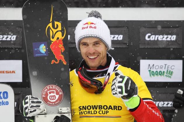 SNOWBOARD - FIS WC Carezza CAREZZA,ITALY,16.DEC.14 - SNOWBOARD - FIS World Cup, parallel giant slalom, men, award ceremony. Image shows the rejoicing of Roland Fischnaller (ITA).