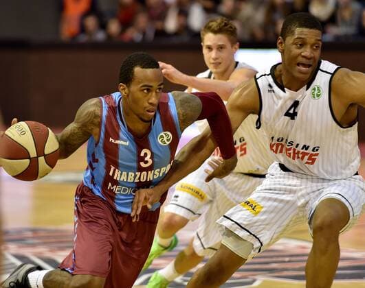 BASKETBALL - FIBA, Guessing vs Trabzonspor GUESSING,AUSTRIA,16.DEC.14 - BASKETBALL - FIBA Euro Challenge,Guessing Knights vs Trabzonspor Medical Park. Image shows Demarquis Bost (Trabzonspor) and Travis Taylor (Guessing).