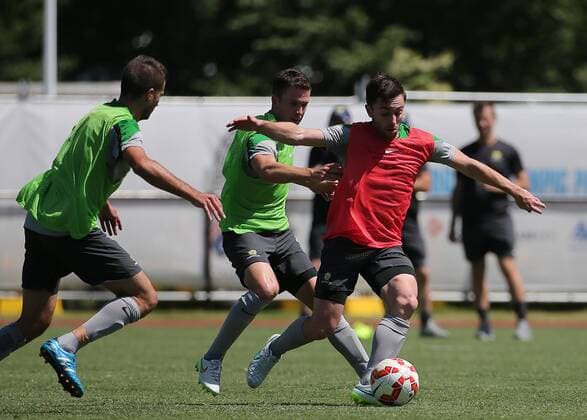 Players of Australian football team participate in a training session ahead of AFC Asian Cup at the Collingwood Training Centre, Olympic Park in Melbourne, Australia on Jan. 3, 2015. XuxYanyan 