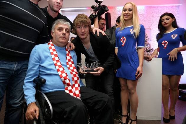 Zagreb, Croatia 03.01.2015., Zagreb, Croatia - In the Matis hall was held awards ceremony Fiery wings. The trophy that fans of Croatian football team awarded the heartiest national team Nationalteam player. Tin Jedvaj with Gjuro Glogoski, war veteran.  AntoxMagzan PIXSELL
