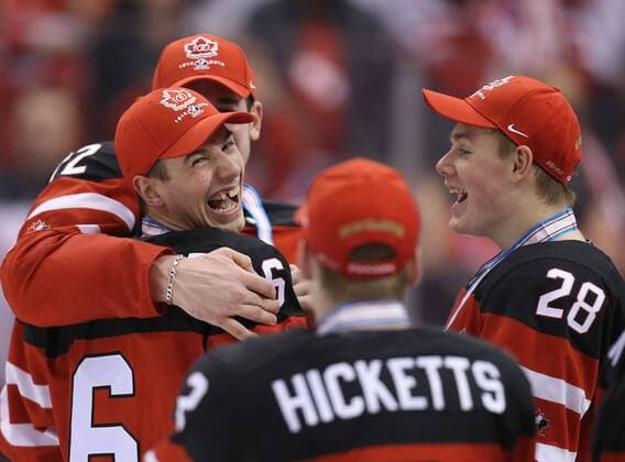TORONTO, CANADA. JANUARY 5, 2015. Canada s Shea Theodore, Joe Hicketts, and Lawson Crouse (L-R) celebrate winning the 2015 IIHF World Junior Championship final Ice hockey Eishockey match against Russia at the Air Canada Centre. The Canadian team won the game 5:4. Yelena Rusko TASS  RE159378