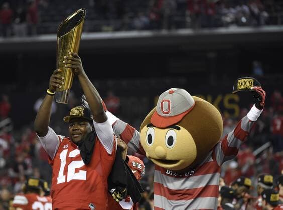 Ohio State Buckeyes quarterback Cardale Jones celebrates with the championship trophy after the Buckeyes defeated the Oregon Ducks to win the College Football Playoff National Championship, in Arlington, Texas on January 12, 2015. The Buckeyes defeated the Ducks 42-20.  ARL20150112408 KEVINxDIETSCH