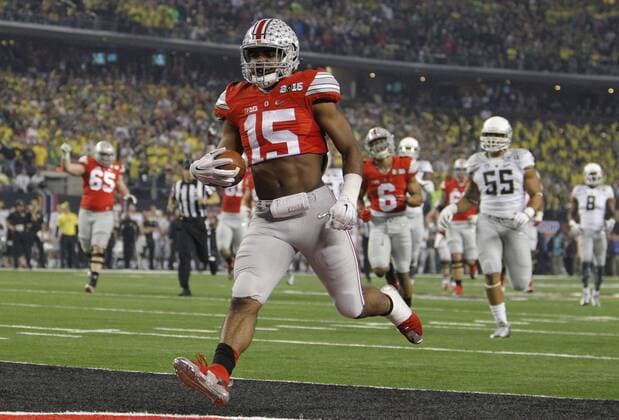 Jan. 12, 2015 - Arlington, TX, USA - Ohio State Buckeyes running back Ezekiel Elliott (15) scores a first quarter touchdown during the CFP National Championship on Monday, Jan. 12, 2015, at AT&T Stadium in Arlington, Texas. CFP National Championship - ZUMAm67_