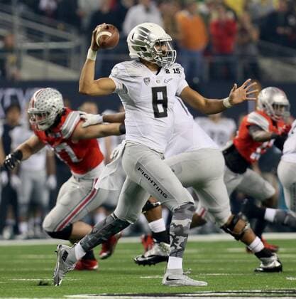 Jan. 12, 2015 - Arlington, TX, USA - Oregon quarterback Marcus Mariota drops back to pass during the first quarter of the CFP National Championship on Monday, Jan. 12, 2015, at AT&T Stadium in Arlington, Texas. CFP National Championship - ZUMAm67_