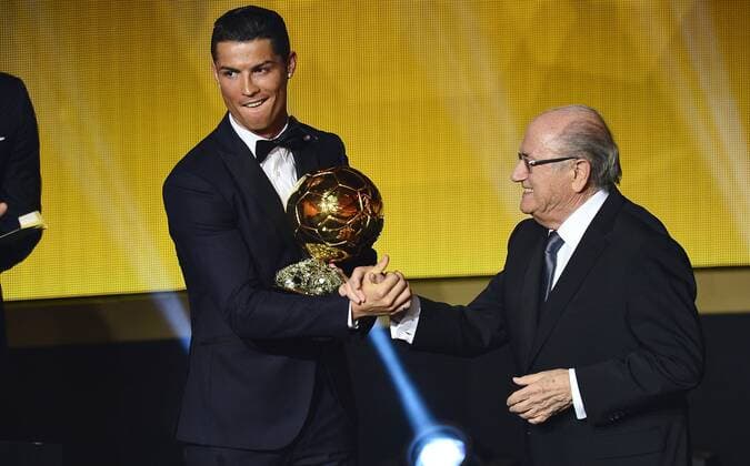 Jan. 12, 2015 - Zurich, Switzerland - FIFA president JOSEPH BLATTER and CRISTIANO RONALDO (Portugal) winner of FIFA Ballon DOR 2014 poses with his trophy during the FIFA World Player Gala in Zurich. Soccer 2015 - FIFA Ballon DOR 2014  - ZUMAm119