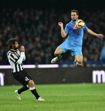 (150112) -- NAPLES, Jan. 12, 2015 -- Juventus Andrea Pirlo (L) vies with Napoli s Gonzalo Higuain during their Italian Serie A soccer match at the San Paolo stadium in Naples, Italy, Jan. 11, 2015. Juventus won 3-1. ) (SP)ITALY-NAPLES-SOCCER-SERIE A AlbertoxLingria 
