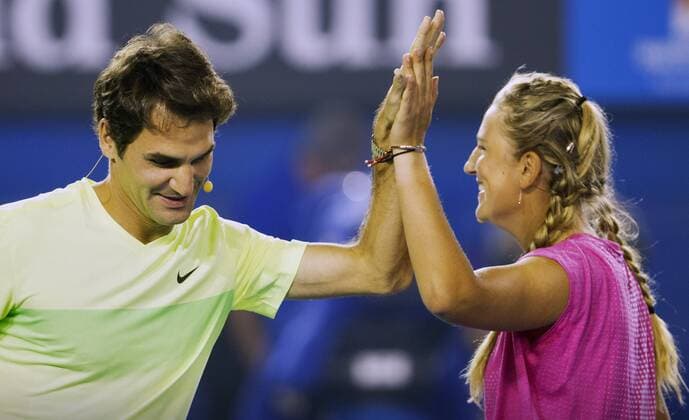 TENNIS - ATP Tennis Herren Australian Open 2015 MELBOURNE,AUSTRALIA,17.JAN.15 - TENNIS - ATP World Tours, Australian Open, preview, kids day exhibition. Image shows Roger Federer (SUI) and Victoria Azarenka (BLR).