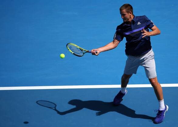 (150119) -- MELBOURNE, Jan. 19, 2015 -- Mikhail Youzhny of Russia competes during the men s singles first round match at the 2015 Australian Open tennis tournament in Melbourne, Australia, Jan. 19, 2015. (SP) XuxYanyan 