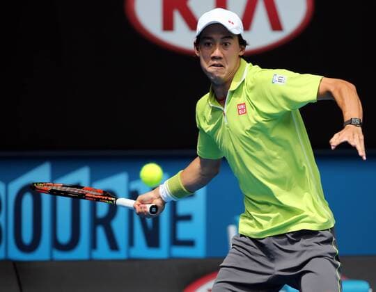 Kei Nishikori of Japan returns the ball during the men s singles first round match at the 2015 Australian Open tennis tournament in Melbourne, Australia, Jan. 20, 2015. XuxYanyan 