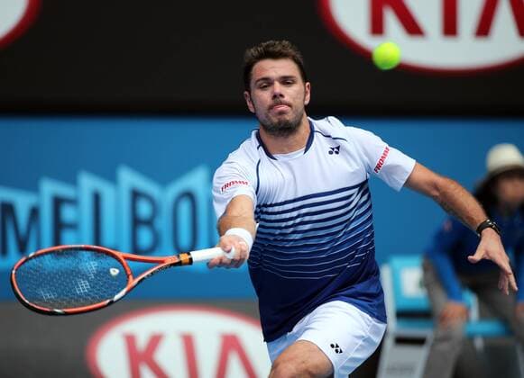 Stan Wawrinka of Switzerland returns the ball during the men s singles first round match at the 2015 Australian Open tennis tournament in Melbourne, Australia, Jan. 20, 2015. XuxYanyan 