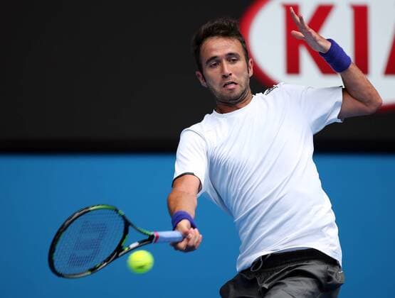 Marsel Ilhan of Turkey returns the ball during the men s singles first round match at the 2015 Australian Open tennis tournament in Melbourne, Australia, Jan. 20, 2015. XuxYanyan 