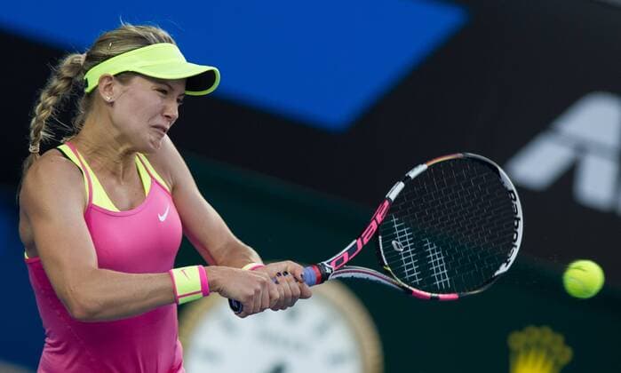 (150121) -- MELBOURNE, Jan. 21, 2015 -- Eugenie Bouchard of Canada returns the ball during the women s singles second round match on the third day of the 2015 Australian Open tennis tournament at Melbourne Park in Melbourne, Australia, Jan. 21, 2015. BaixXue 