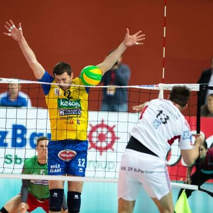 VOLLEYBALL - Aich Dob vs Friedrichshafen KLAGENFURT,AUSTRIA,21.JAN.15 - VOLLEYBALL - CEV, Champions League, SK Aich Dob vs VfB Friedrichshafen. Image shows Adrian Radu Gontariu (Friedrichshafen) and Aleksandar Simeonov (Aich).