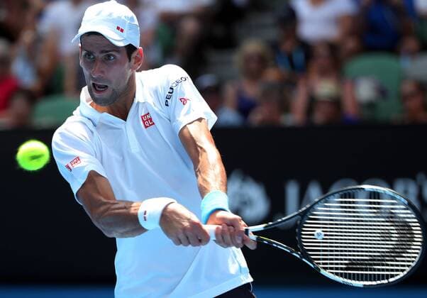 (150122) -- MELBOURNE, Jan. 22, 2015 -- Novak Djokovic of Serbia returns the ball during the second round match of men s singles at the 2015 Australian Open tennis tournament in Melbourne, Australia, Jan. 22, 2015. XuxYanyan 