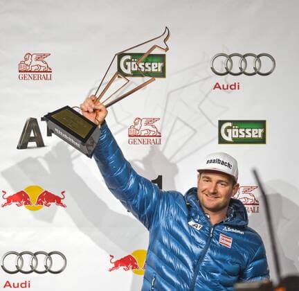 ALPINE SKIING - FIS WC Kitzbuehel KITZBUEHEL,AUSTRIA,23.JAN.15 - ALPINE SKIING - FIS World Cup, super giant slalom, men, award ceremony. Image shows the rejoicing of Georg Streitberger (AUT). Keywords: trophy.